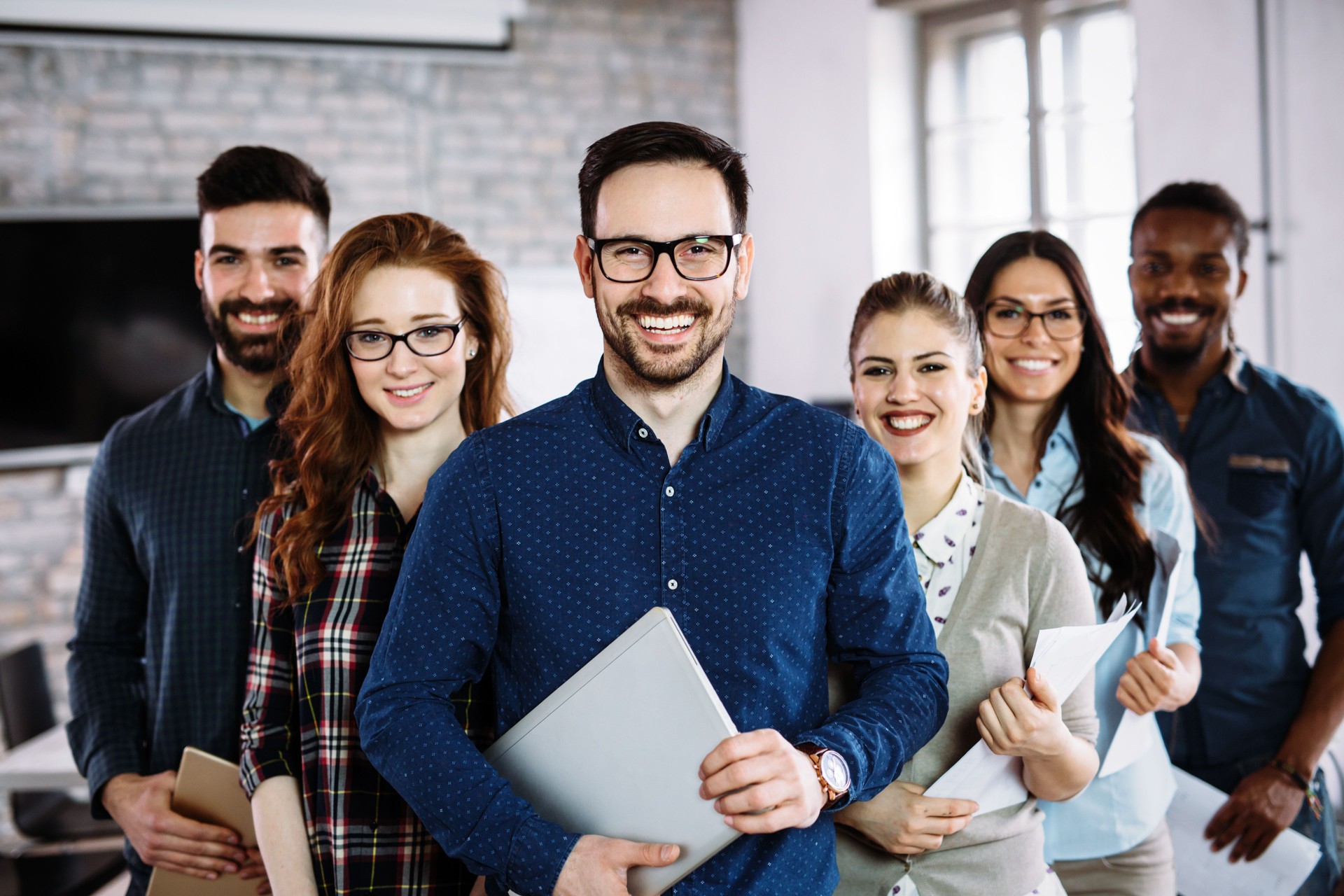 Portrait of successful business team posing in office